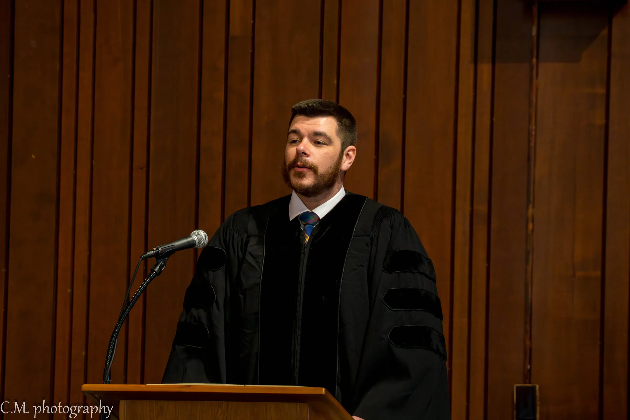 The pastor in his robe at the pulpit