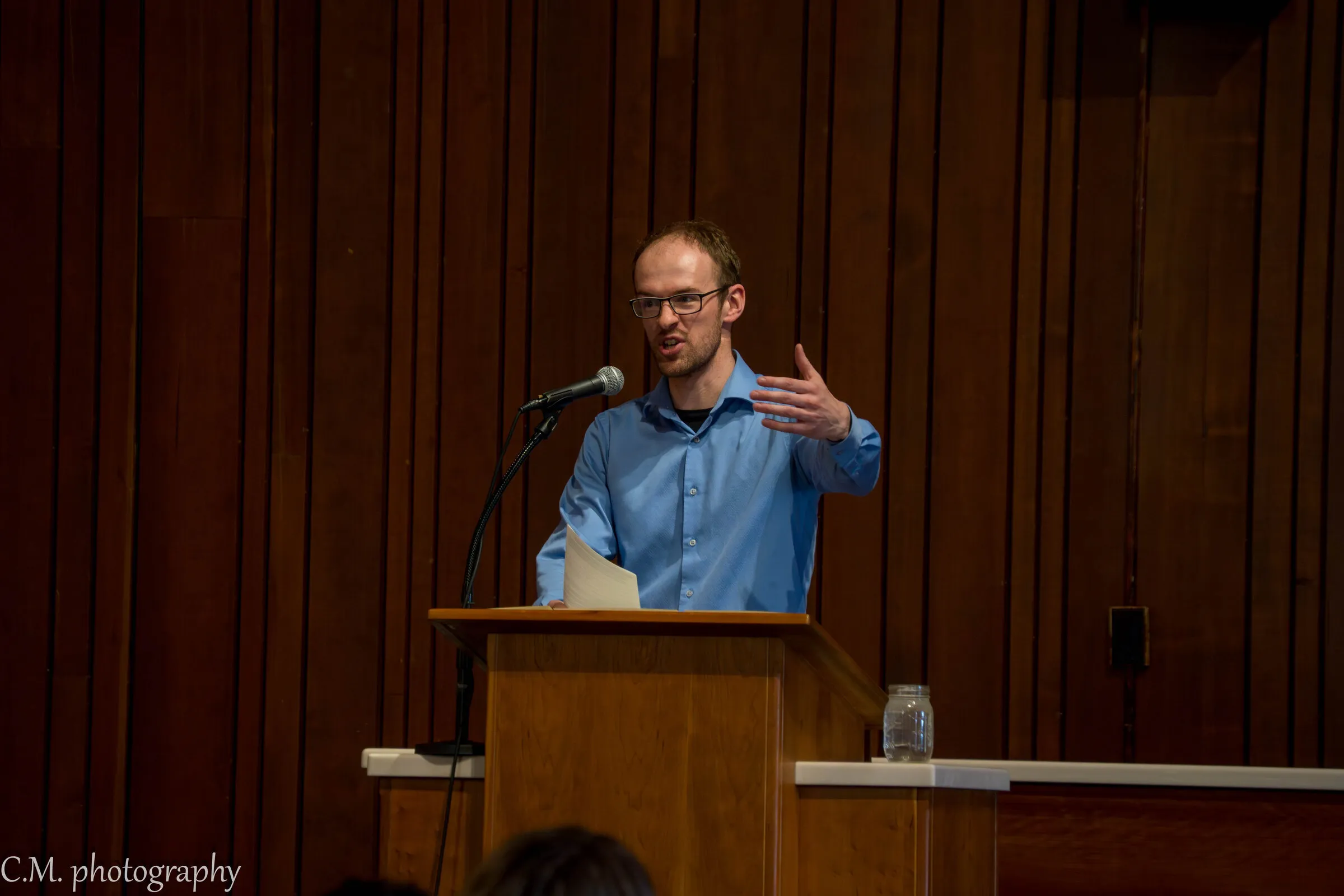 A man speaking from the lectern