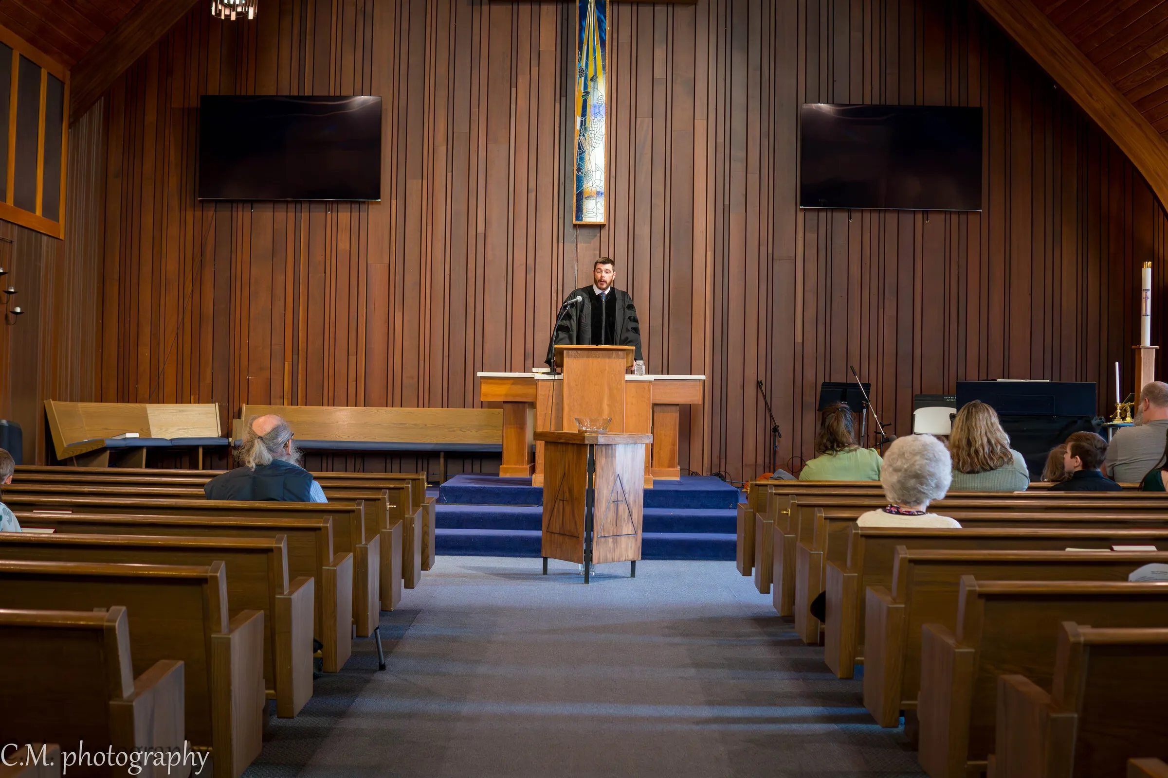 The congregation in worship, seen from the back
