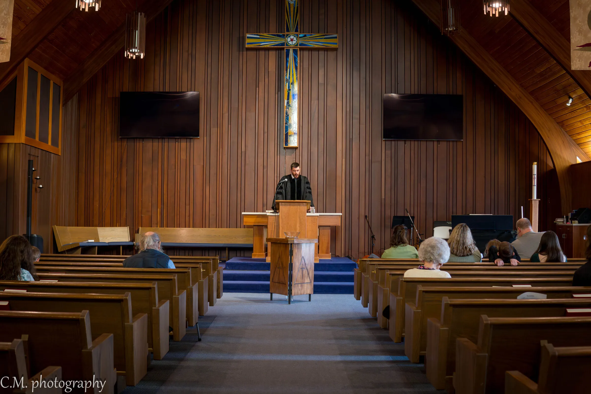 The pastor preaching from the pulpit