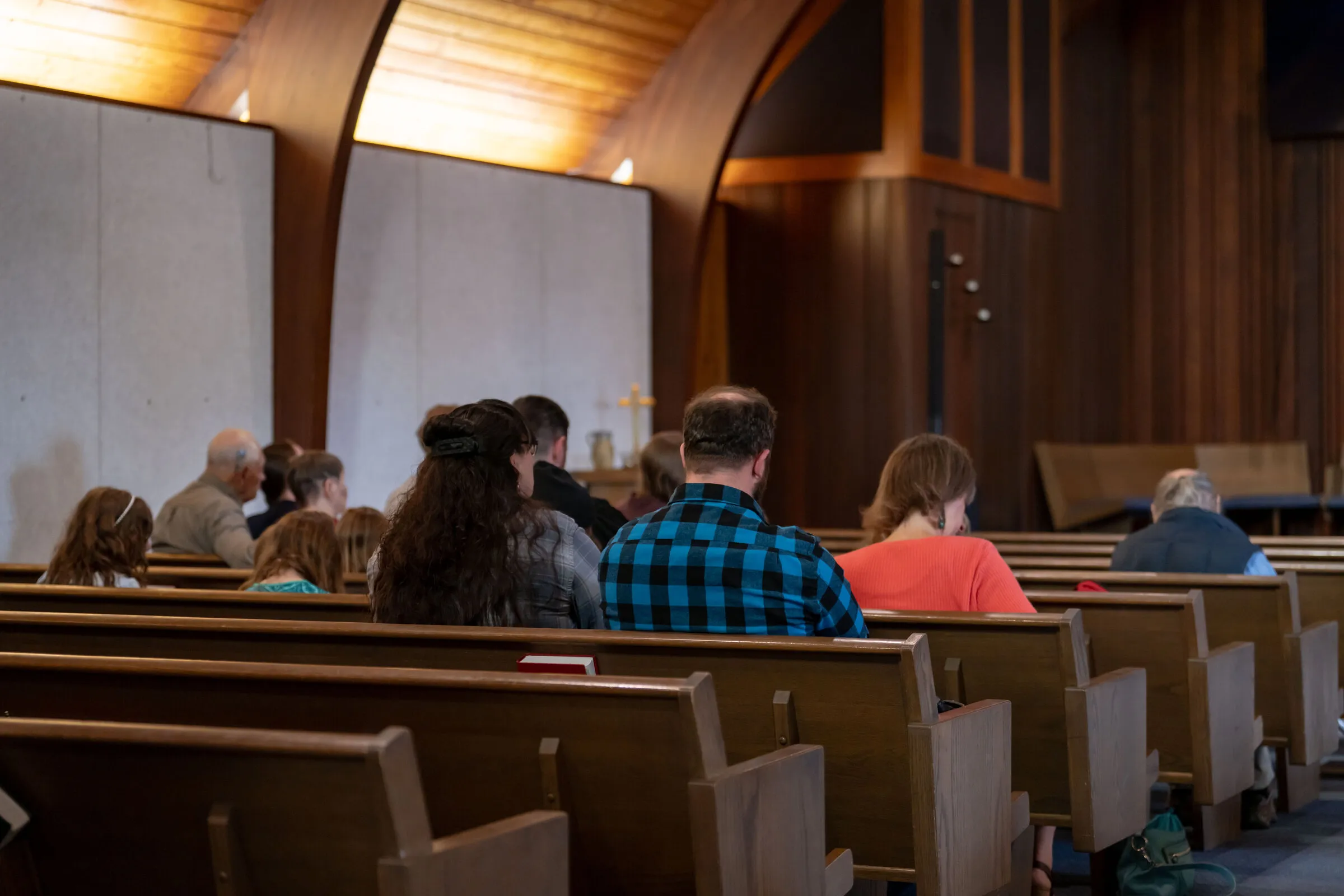 The congregation seated in the pews before Sunday worship